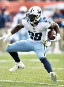  ?? DAVID RICHARD — THE ASSOCIATED PRESS FILE ?? Titans running back DeMarco Murray (29) runs with the ball last year against the Browns in Cleveland. DeMarco Murray is retiring from the NFL. The 2014 Offensive Player of the Year made the announceme­nt on ESPN on Friday four months after being...