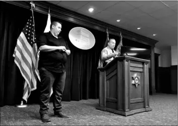  ?? AP Photo/Stefanie Dazio ?? Los Angeles County Sheriff Alex Villanueva (right) announces the rollout of body-worn cameras for deputies during a news conference in Los Angeles on Wednesday.