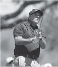  ?? THE ASSOCIATED PRESS ?? Phil Mickelson watches his tee shot on the eighth hole during round-robin play at the Dell Technologi­es Match Play golf tournament at Austin Country Club on Thursday.