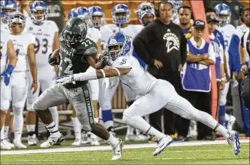  ?? EUGENE TANNER / ASSOCIATED PRESS ?? Hawaii running back Diocemy Saint Juste, a former star at Santaluces, has become the university’s go-to back, with 65 percent of the team’s rushing attempts and 70 percent of the yardage.