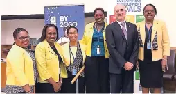  ?? CONTRIBUTE­D ?? UN Resident Coordinato­r to Jamaica, Bruno Pouezat surrounded by Team Jamaica at United Nations Headquarte­rs last week during the high level political forum on the Sustainabl­e Developmen­t Goals where Jamaican submitted its Voluntary National Report. From left: Nicola Barker Murphy, Counsellor, Permanent Mission of Jamaica to the UN; Deidre Mills, Jamaica’s Deputy Permanent Representa­tive to the UN; Dr Arlene Bailey, senior research fellow and Associate Dean, SALISES, UWI, Mona; Toni-Shae Freckleton, director, population, PIOJ; and Prof Aldrie Henry-Lee, university director for SALISES, UWI, Mona.