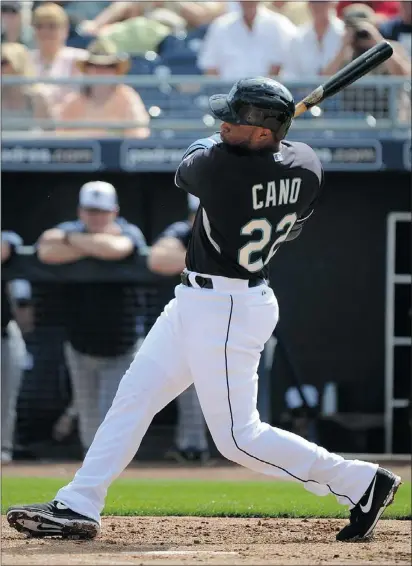  ?? — GETTY IMAGES ?? Second baseman Robinson Cano hits a single in the first inning in his first at bat with the Seattle Mariners against the San Diego Padres in Peoria, Ariz., Thursday.