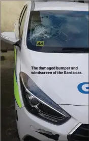  ??  ?? The damaged bumper and windscreen of the Garda car.