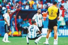  ?? AFP ?? Argentina’s Lionel Messi and teammates look dejected after their defeat to France at the Kazan Arena yesterday.