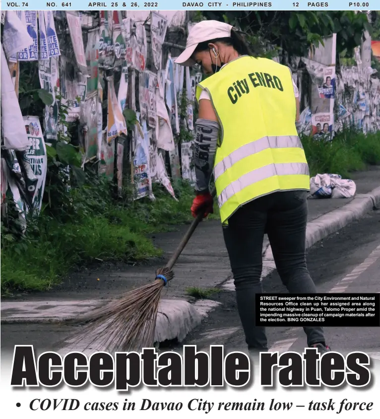  ?? BING GONZALES ?? STREET sweeper from the City Environmen­t and Natural Resources Office clean up her assigned area along the national highway in Puan, Talomo Proper amid the impending massive cleanup of campaign materials after the election.