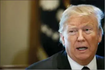  ?? JACQUELYN MARTIN — THE ASSOCIATED PRESS ?? President Donald Trump leads a roundtable discussion on border security with local leaders, Friday in the Cabinet Room of the White House in Washington.