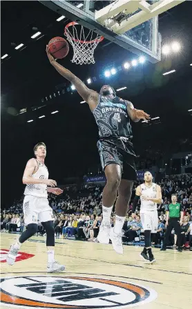  ?? PHOTO: GETTY IMAGES ?? Hoopla . . . Breakers forward Armani Moore goes to the basket during his side’s ANBL match against the Brisbane Bullets in Auckland last night.