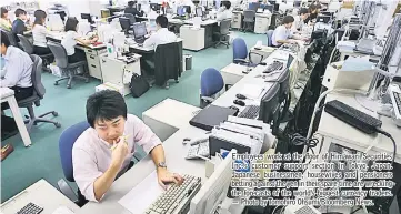  ??  ?? Employees work at the floor of Himawari Securities Inc.’s customer support section in Tokyo, Japan. Japanese businessme­n, housewives and pensioners betting against the yen in their spare time are wrecking the forecasts of the world’s biggest currency...