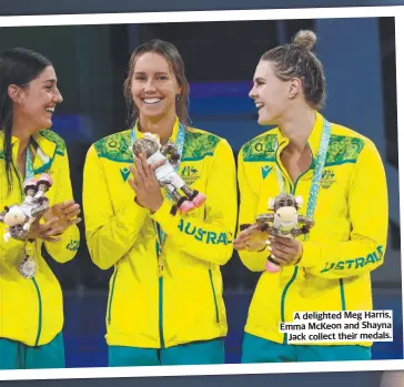  ?? ?? A delighted Meg Harris, Emma Mckeon and Shayna Jack collect their medals.