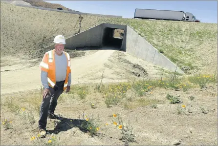  ?? PHOTO BY WILL LESTER ?? Wildlife biologist Paul Gonzales stands near one of two wildlife tunnels being installed during the 60Freeway widening project in the Badlands area east of Moreno Valley on June 4. The tunnels will help a variety of wildlife species travel north and south without the hazards of crossing the freeway.