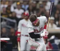  ?? DERRICK TUSKAN — THE ASSOCIATED PRESS ?? Bryce Harper slams his bat in disgust after being hit by a Blake Snell fastball that broke his left thumb on June 25in San Diego.