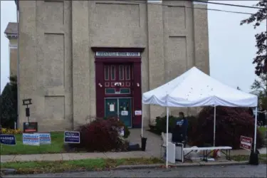  ?? MARIAN DENNIS — DIGITAL FIRST MEDIA ?? More than 100 voters may have received the wrong ballot Tuesday morning at a Phoenixvil­le polling location at 153 Church St. The first 108 voters all received ballots for the 155th state House District even though the precinct is split between the 155th District and the 157th District.