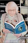  ?? DENNIS SULLIVAN/DAILY SOUTHTOWN ?? Jean Sherrill, who will turn 100 Nov. 29, peruses Shakespear­e in the office of her Homewood home. Sherrill's birthday will be celebrated at her church, which is marking its 175th anniversar­y this year.