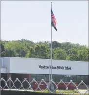  ?? Paul Augeri / For Hearst Connecticu­t Media ?? The area surroundin­g the front ofWoodrowW­ilson Middle School recently has been enclosed by eightfooth­igh fencing. Constructi­on on a new school on the land in front of the existing building begins soon.