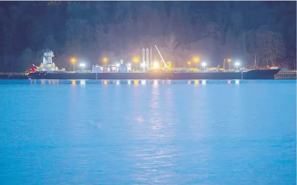  ?? GERRY KAHRMANN/PNG FILES ?? A ship berthed at the Kinder Morgan Trans Mountain Westridge Marine Terminal in Burnaby. With a minority government on the horizon for B.C., the Trans Mountain pipeline’s risk profile hasn’t changed legally, but it has politicall­y, writes Chris Varcoe.