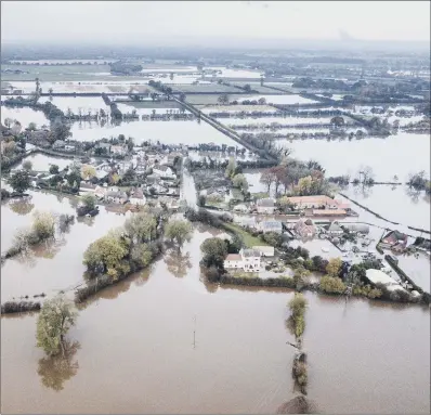  ?? PICTURE: TOM MADDICK/SWNS. ?? The village of Fishlake, Doncaster, and surroundin­g land has been left submerged by flooding.