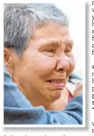  ??  ?? Victim’s sister Judy Cruz is overcome with grief.