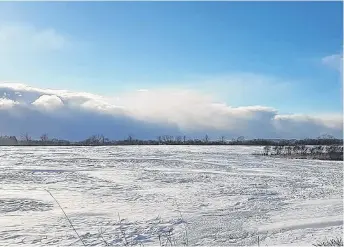  ??  ?? %ands of heavy snow on an otherwise sunny day Lisa Seaton spotted this snow squall coming across the marsh to the west end of Truro, N.S. The stronger wind, the farther they travel.