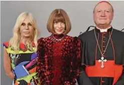  ??  ?? (From left) Italian designer Donatella Versace poses on February 26, 2018, with editor-in-chief of Vogue Anna Wintour and cardinal Gianfranco Ravasi, President of the Vatican Pontifical Council for Culture, at Rome’s Palazzo Colonna at the end of the...