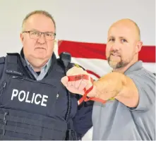  ?? LAWRENCE POWELL ?? Annapolis District RCMP community programs officer and MADD member Adam Burns, right, and Sgt. Jamie Greene attended the Bay of Fundy NS Chapter of Mothers Against Drunk Driving Project Red Ribbon campaign launch at the Middleton fire hall Nov. 13.