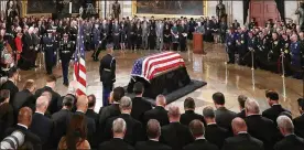  ?? CHIP SOMODEVILL­A / GETTY IMAGES ?? Former U.S. President George H.W. Bush’s flag-draped casket lies in state inside the U.S. Capitol Rotunda during an arrival ceremony Monday in Washington, DC. Bush, the 41st president of the United States died Nov. 30 at age 94.