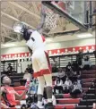  ?? / Contribute­d by Gail Conner ?? Zah Frazier hit a big dunk of his own against the visiting Sandy Creek Patriots during the Bulldogs’ final regular season home game of the 201819 season.
