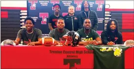  ??  ?? Trenton High’s (front row, from left) Jazzir Merricks, Zamir Travers, Shaun Balkcom and James Hubbard, and (standing) Paynn Robinson, coach Greg Hyslop and Lavor Funderburg got together for a recent signing ceremony. Not pictured is Kayshaun Massey.