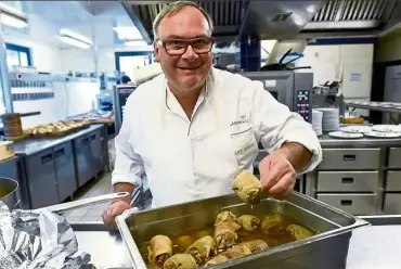  ??  ?? Chef Quinton likes to grill skewered tripe with lobster and scallops.