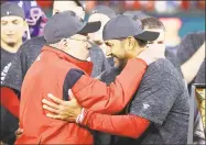  ?? Rob Carr / Getty Images ?? Nationals owner Ted Lerner, left, and manager Dave Martinez celebrate after winning Game 4 of the National League Championsh­ip Series against the Cardinals on Tuesday.