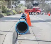  ?? Bobby Block/The Signal ?? Lengths of 14-inch ductile iron water pipe are lined up along Decoro Drive, awaiting placement by SCV Water crews. The water agency said it is replacing a 1,500-foot section of pipe in the next three months.