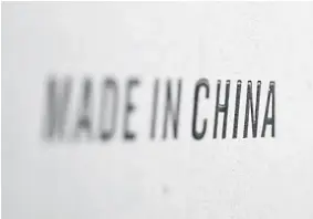  ?? — Reuters photo ?? Words ‘Made in China’ are pictured on a box of products imported from China at a wholesale shop in Paris, France.