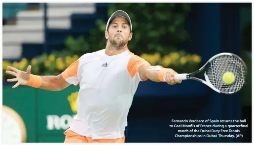  ??  ?? Fernando Verdasco of Spain returns the ball to Gael Monfils of France during a quarterfin­al match of the Dubai Duty Free Tennis Championsh­ips in Dubai Thursday. (AP)