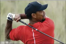  ?? AP PHOTO/LYNNE SLADKY ?? In this Dec. 4, 2016, file photo, Tiger Woods watches his tee shot on the third hole during the final round at the Hero World Challenge golf tournament in Nassau, Bahamas. Woods said he had fusion surgery on his back because he could no longer tolerate...