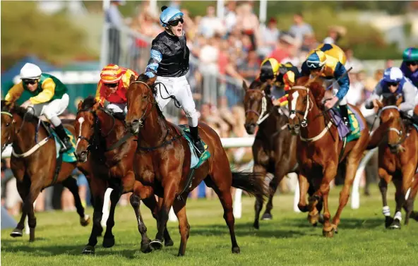  ??  ?? Rider Rory Hutchings celebrates his first Group I win as Soriano wins the Zabeel Classic at Ellerslie yesterday. Weregoingt­ogetcha, hooped cap, was second, with fourth placegette­r Graphic, white cap, on the rails. Third placegette­r Pondarosa Miss is...