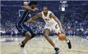  ?? RON SCHWANE / AP ?? Cavaliers forward Evan Mobley drives against the Magic’s Jonathan Isaac during Game 2 of their playoff series in Cleveland on Monday. The Cavs won 96-86.