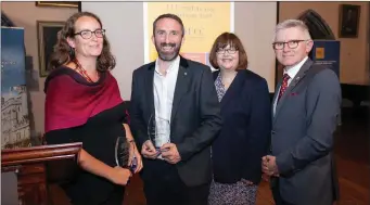  ??  ?? From left: Dr Cliona O’Carroll and Dr Tomás Mac Conmara of the Cork Folklore Project, who both received awards at the recent UCC Staff and Research Awards with UCC President Patrick O’Shea.