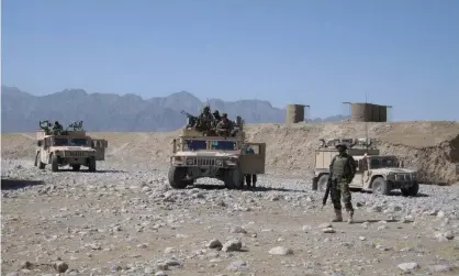  ?? Photograph: Max Blenkin/AAP ?? Afghan National Army soldiers patrol with Australia during the conflict. A civilian who served in Afghanista­n has rejected suggestion­s all interprete­rs ‘who went out on the ground’ have had their cases resolved by Australia.