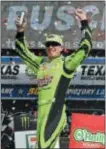  ?? LARRY PAPKE — THE ASSOCIATED PRESS ?? Kyle Busch celebrates in Victory Lane after winning a NASCAR Cup Series auto race in Fort Worth, Texas, Sunday.
