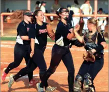  ?? LARRY GREESON / For the Calhoun Times ?? Sonoravill­e’s Alyssa Hughes (from left), Griffin Holden, Kristen Davis and Sandra Beth Pritchett celebrate after getting a big out during Tuesday’s game.