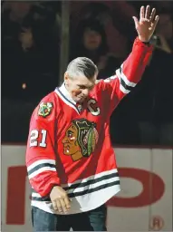  ?? Associated Press photo ?? In this 2008 file photo, Chicago Blackhawks great Stan Mikita waves to fans as he is introduced before an NHL hockey game against the San Jose Sharks in Chicago.