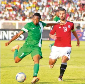  ?? PIC: Shehu K. Goro. ?? Super Eagles forward Ahmed Musa and Abdallah Elsaid of Egypt contest for the ball during the first leg of the 2017 AFCON qualifier at Ahmadu Bello Stadium in Kaduna