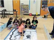  ??  ?? Truman Elementary School students put robots through their paces during a 2016 Botball challenge.