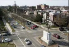  ?? STEVE HELBER — THE ASSOCIATED PRESS ?? In this traffic passes by the statue of Confederat­e General Stonewall Jackson at the intersecti­on Traffic passes by the statue of Confederat­e General Stonewall Jackson at the intersecti­on of Monument Avenue and The Boulevard in Richmond, Va.