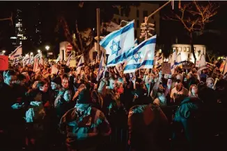  ?? Associated Press file photo ?? Demonstrat­ors last month in Tel Aviv, Israel, call for new elections and protest against Prime Minister Benjamin Netanyahu’s handling of the war against Hamas.
