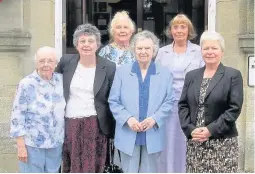  ??  ?? ‘Old girls’ visit Aberdare Girls’ School for the last time – including former headteache­r Tydfil Thomas and chairwoman of governors Anne Watts – with headteache­r Jane Rosser, right