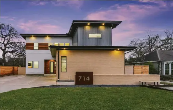  ?? PRSTX.com ?? This Garden Oaks home on Sue Barnett Street, designed by Echo Custom Homes, has a cantilever­ed entry with brick, stucco and ipe wood exterior. Don’t miss its second-story tequila room.