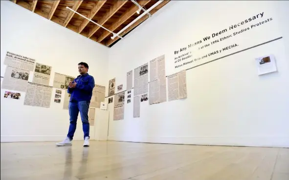  ?? Matthew Jonas / Staff Photograph­er ?? Mateo Manuel Vela stands near his exhibit at the Boulder Museum of Contempora­ry Art. “I was really fascinated by this particular student movement because it was led by a multiracia­l group of students,” he said.