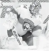  ?? KATHY WILLENS/AP ?? Panthers goaltender James Reimer makes a glove save during Monday’s 3-0 shutout of the New York Islanders.