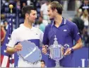  ?? John Minchillo / Associated Press ?? Novak Djokovic, left, and Daniil Medvedev, talk during the trophy ceremony after the men's singles final at the U.S. Open on Sunday.