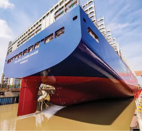  ?? AFP ?? The world’s first LNG-powered 23,000-TEU container ship in Shanghai; the industrial sector in Asia is the biggest driver of LNG growth.